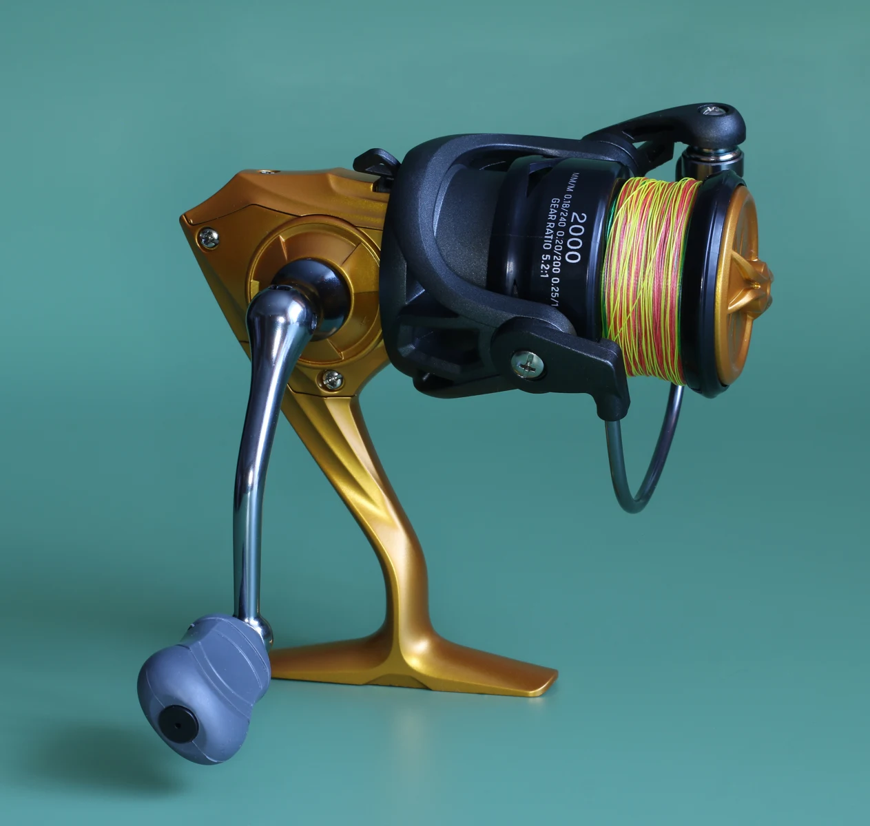 A spinning reel fitted with multicolored braided fishing line.